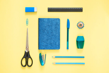 Flat lay blue stationery on a yellow background. Geometry, knolling