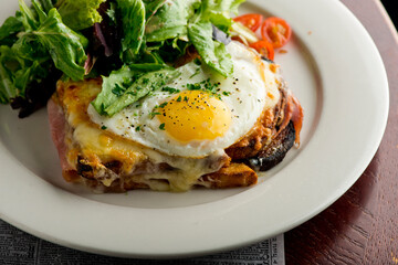 Omelette made with bacon, ham, sausage, bell peppers, heirloom tomatoes, spinach, onions, cheddar & Swiss cheese. Served with crispy potato hash, a classic American breakfast or brunch favorite.