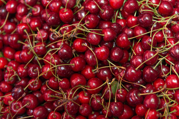 Rape, red cherries background.