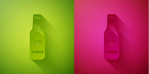 Paper cut Tabasco sauce icon isolated on green and pink background. Chili cayenne spicy pepper sauce. Paper art style. Vector.