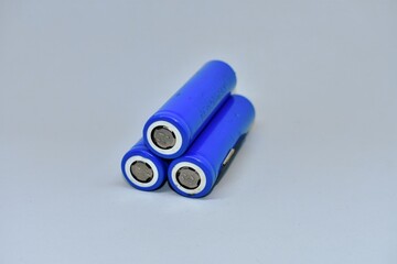 Three rechargeable 18650 lithium-ion batteries. isolated on a white background. batteries for...