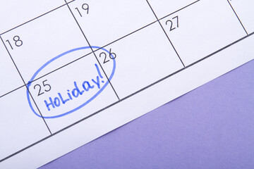 25th day of the month marked as a holiday. Signed by blue highlighter pen. Waiting for a holiday.