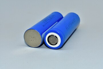 two rechargeable 18650 lithium-ion batteries. isolated on a white background. batteries for...