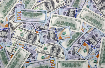  Heap of one hundred dollar bills on money