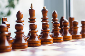 Chessmen on a chessboard, white background, Chess pieces on a chessboard