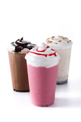 Strawberry, chocolate and white iced milkshakes isolated on white background. 	