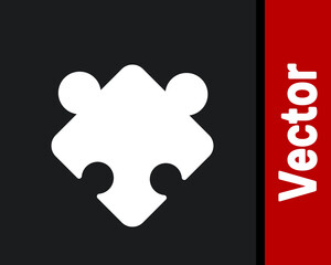 White Puzzle pieces toy icon isolated on black background. Vector.