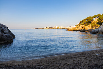 View of the St. Jordi cove with the first rays of the sun, Costa Brava, Catalonia, Spain.
