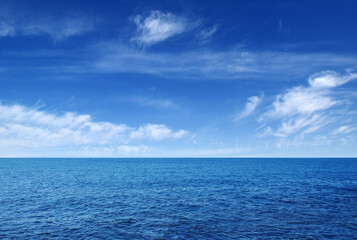 Naklejka na ściany i meble Blue sea with waves and sky