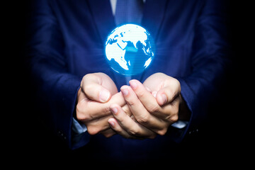 Businessman hands holding blue glowing digital hologram of globe, businessman hand with globe.