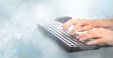 Business woman typing on keyboard