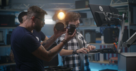 Costumer check lens in video equipment store