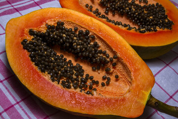 Papaya cut in half closeup picture