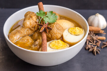 Eggs and chicken in brown sauce chicken stewed in the sweet brown Gravy,Hard boiled egg and stewed chicken in gravy sauce,Thai Cuisine call Kai Pha Lo
