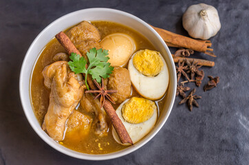 Eggs and chicken in brown sauce chicken stewed in the sweet brown Gravy,Hard boiled egg and stewed chicken in gravy sauce,Thai Cuisine call Kai Pha Lo
