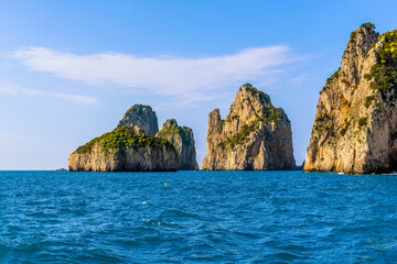 The Faraglioni rocks jut out to sea on the eastern side of the Island of Capri, Italy