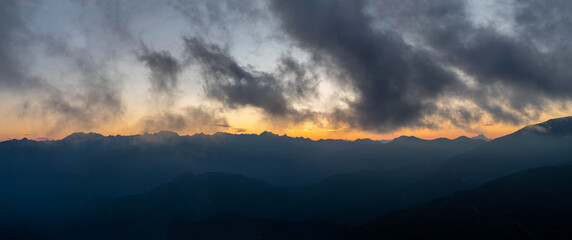 Fototapeta premium Silhouette Maritime Alps mountain range against sky at sunset, South France