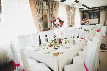 Interior of a restaurant prepared for wedding ceremony