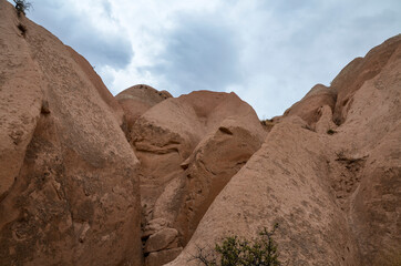 Fototapeta premium Unique limestone pyramids with beautiful old rock formations in Cappadocia, Goreme, Turkey