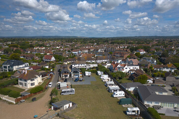 Beautiful aerial photo of East Preston beach front on a warm and sunny day with small cumulus clouds.