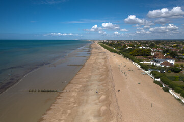 Fototapeta na wymiar East Preston beach aerial photo looking west on a warm and sunny English summers day .