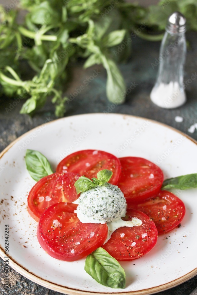 Wall mural salad with tomatoes and basil ice cream. restaurant serving.