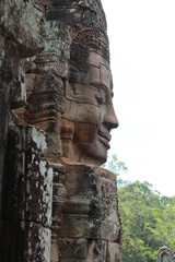 Stone murals and sculptures,Stone face of god on top of Angkor Thom, A famous place in Bayon Temple,Angkor Wat, Siem Reap, Cambodia.