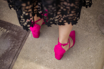 woman legs in pink shoes