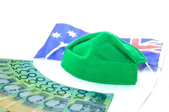 Concept 100 Dollar Australian. Medical Green Mask, Economy Crisis. Health Expense. Outbreak Of Coronavirus..