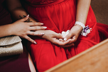 women hands in red dress