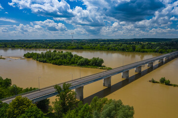 Obraz premium Bridge over Vistula river in Kamien, Poland. Aerial view of Vistula river, the longest river in Poland.
