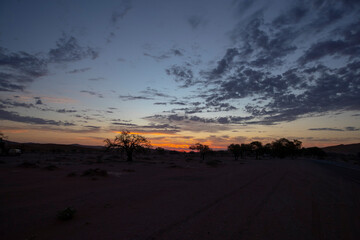 Sossusvlei is a salt and clay pan surrounded by high red dunes, located in the southern part of the Namib Desert, in the Namib-Naukluft National Park of Namibia.