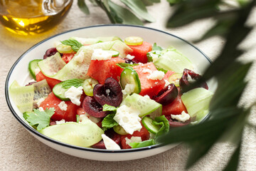 fresh Salad with watermelon, cucumber, cherries and cheese