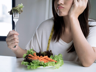 Asian women are not happy, She doesn't want to eat vegetables.