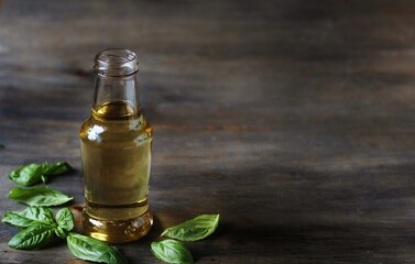 Basil  Syrup on a dark background . Soft focus. Place for text. Copy Space