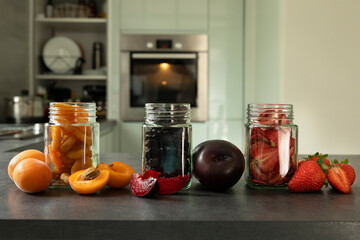 Dried fruits and fruit chips along with the fresh fruit of which they are made.
