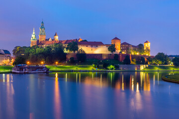 Fototapeta na wymiar Wawel castle in Krakow at Vistula river at night, Poland