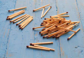 On the wooden table are matches for household needs