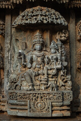 Fototapeta na wymiar Stone Sculpture of Shiva and Parvati