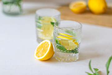 Top view of refreshing lemonade in glass on white background. Summer drinks with ice