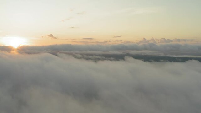 Dense fog above above Moosehead lake aerial reveals sunrise 