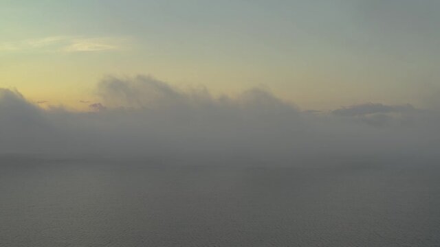 Thick fog drifts high above Moosehead lake Aerial 