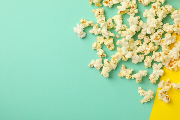 Tasty popcorn on two tone background. Food for watching cinema