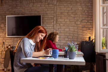 Woman taking notes in a planner