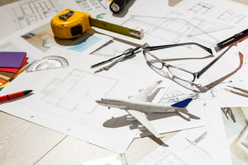 Tools and papers with sketches on the table