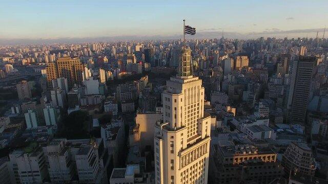 Aerial, sunset over Altino Arantes Building in Sao Paulo