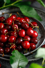 Fresh sweet cherries on table with water drops 