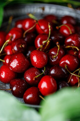 Fresh sweet cherries on table with water drops 