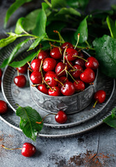 Fresh sweet cherries on table with water drops 