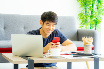 portrait of social media influencer live streaming with notbood computer to vlogging followers. work from home concept.